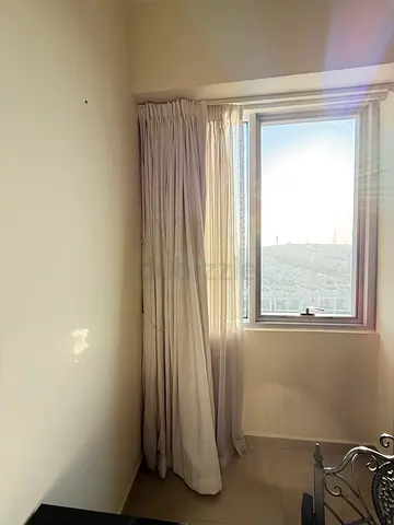 Light beige full-length curtains with blackout lining - good condition