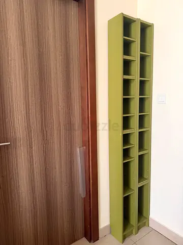 Long wall-mounted multi-cubby shelf (green) - good condition