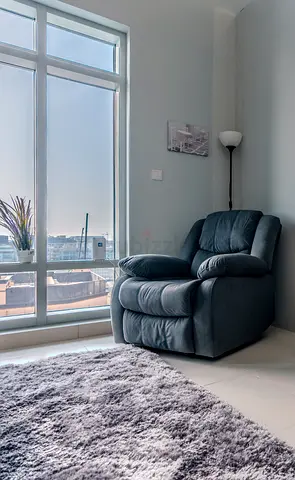 Single grey recliner armchair in good condition