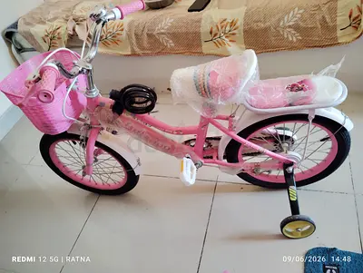 Pink Childrens Bicycle with Training Wheels and Basket