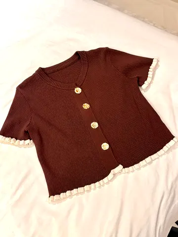Brown ribbed short-sleeve womens top with gold buttons and ruffle trim