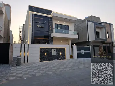 Luxury villa for sale in Al Helio 2 - Ajman | 5 master rooms + roof Registration fees and air conditioning included