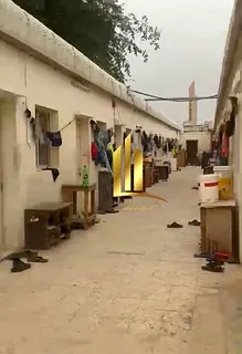 For sale: Workers' accommodation, a fenced area, and two shops in Al Sajaa Industrial Area, Shar