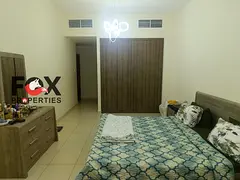 Spacious 2BR for sale in Ajman One Towers. Laundry & storage room, open view, private parking, near 