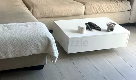 Low white modern coffee table.