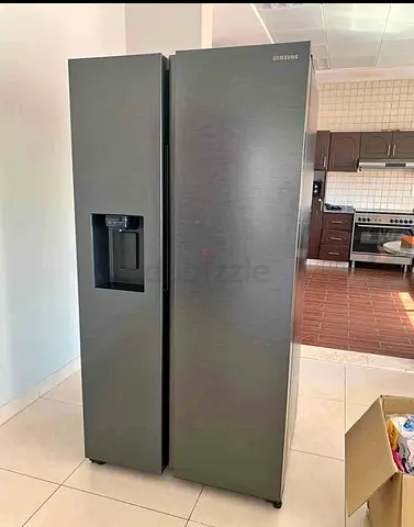 Samsung side by side refrigerator with water dispancer neat and clean perfect working