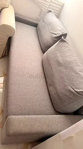 Light grey two-seater sofa- Bed in good used condition