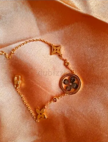Gold-tone Designer Bracelet with Floral Medallion. Preloved. Going For Just AED 700.