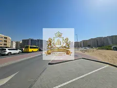 For sale: Commercial land in a strategic location directly on a main road in the Muwailih commercial