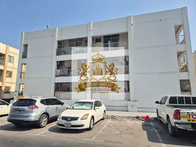 For sale in Sharjah... Abu Shagara area... Ground floor and two-story building... Consisting of 9 two-bedroom apartments... Land area: 2,600 square fe