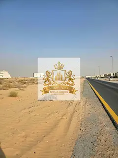 For sale in Sharjah - Corner plot on two streets, 24 meters each - Rawdat Al Qurt - opposite Al Suyo