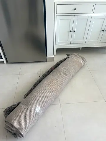 Light grey textured area rug - rolled, unused condition