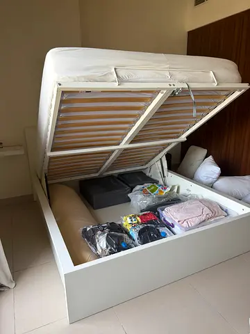 White Storage Ottoman Bed Frame with Lift-Up Base. Mattress not included.