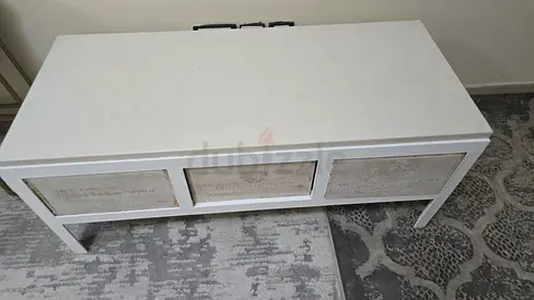 Coffee table with three drawers.
