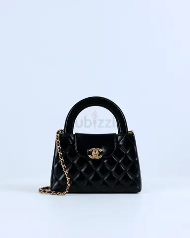 Authentic Chanel Kelly Bag Shiny Aged Calfskin  Gold-Tone Metal in Black Medium size