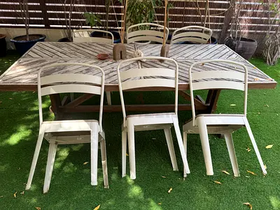Outdoor wooden dining table with 6 metal chairs - weathered rustic set
