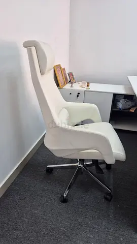 White ergonomic high-back office chair with headrest. Boss chair