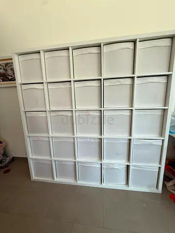 IKEA Kallax-style 25-cube white storage shelf with bins