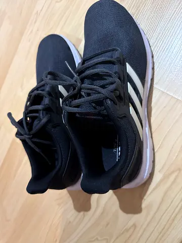 Black Adidas running shoes, lightly used, size not specified