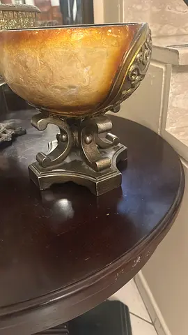 Decorative alabaster-style bowl on ornate metal stand - good condition