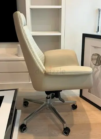 URGENT SALE – AED 200- Comfortable cream leather swivel office chair, good condition