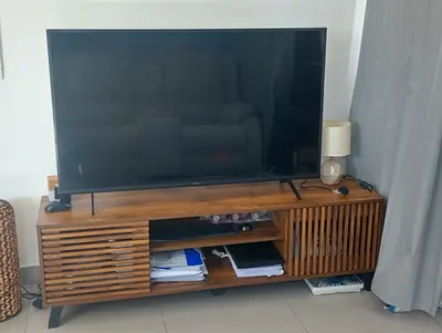 Classy TV Stand with sliding door compartment