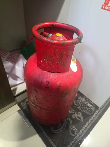 Used Red Gas Cylinder — Functional, Well-Worn