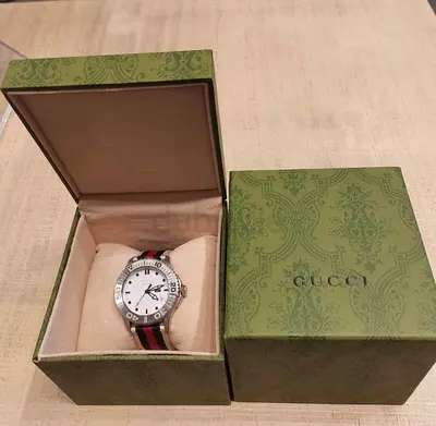 Gucci sport watch Genuine 42 mm flawless good as new. Watch  box only.