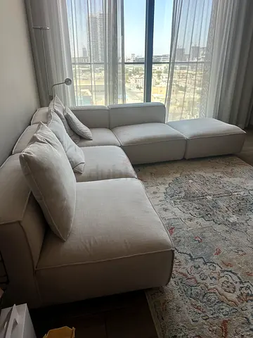 Light beige L-shaped sectional sofa with ottoman - great condition