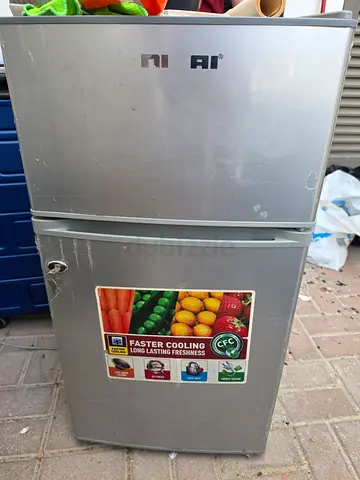 Small two-door fridge in good working condition - compact freezer on top