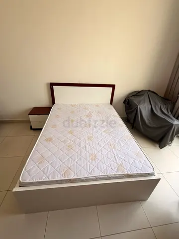 Single bed frame with mattress and bedside table - used