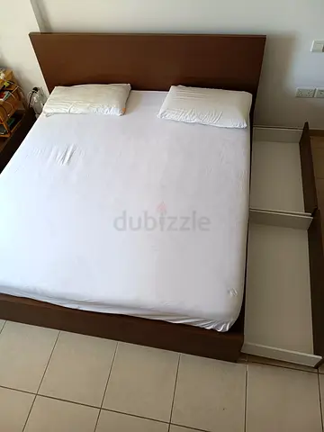 Queen double bed frame with 4  side drawers + two new mattress - good condition. Pickup 10-12 July