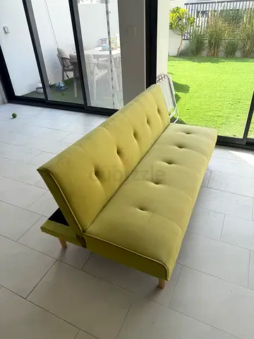 Green convertible sofa bed / futon in good condition