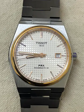 Tissot PRX Powermatic 80 stainless steel watch — two-tone bezel, white waffle dial