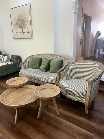 Pair of vintage-style striped loveseat and armchair with wooden frame