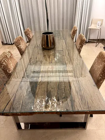 Glass top dining table with 8 upholstered chairs
