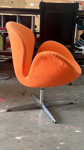 Orange Swivel Lounge Chair - Modern Design, Good Condition