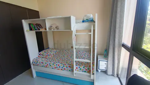 White wooden bunk bed with storage drawers and bookshelf - good condition