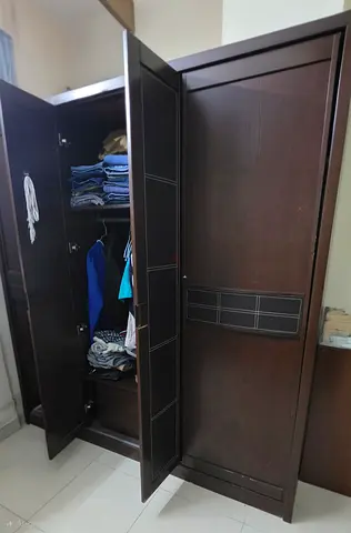 Spacious Dark Wood Three Door Wardrobe
