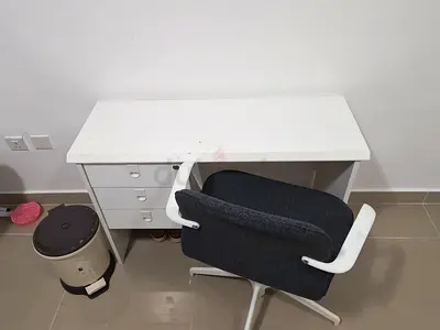 White wooden desk with drawer unit and swivel chair