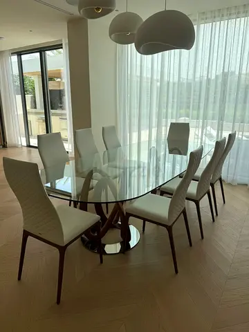 Dining table and chairs by Paroda