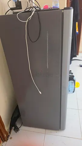 Used single-door upright freezer in good working condition