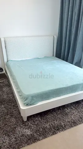 White queen bed frame with upholstered headboard - good condition with mattress