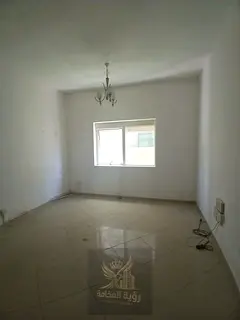 A spacious studio in Al Khan with built-in wardrobes and a dirt parking behind the building, familie
