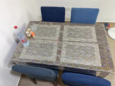 Wooden dining table with 4 upholstered chairs - good condition