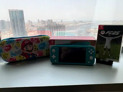 Turquoise Nintendo Switch Lite with Mario Case and FIFA 25 Game