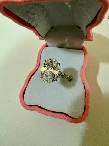 Solitaire-style engagement ring with side stones