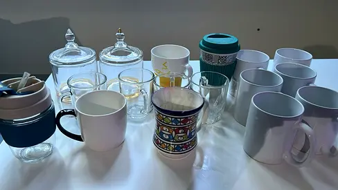 Mixed set of mugs, glass cups and travel tumblers