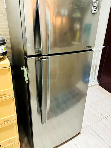 Used stainless steel double-door refrigerator - top freezer