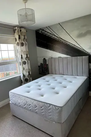 Grey upholstered divan bed with mattress - good condition